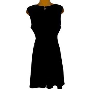 Black Tommy Hilfiger fit and flare sleeveless dress. Size 12. 38” from shoulder.
